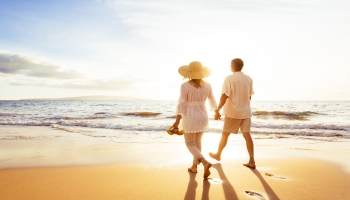 Couple-in-Golden-Years-Walking-Along-the-Beach.jpg